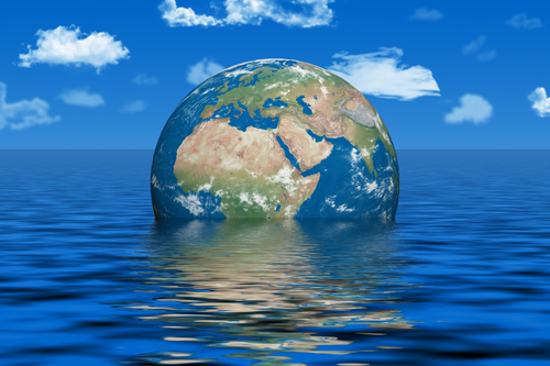 The globe of the Earth sinking into the sea