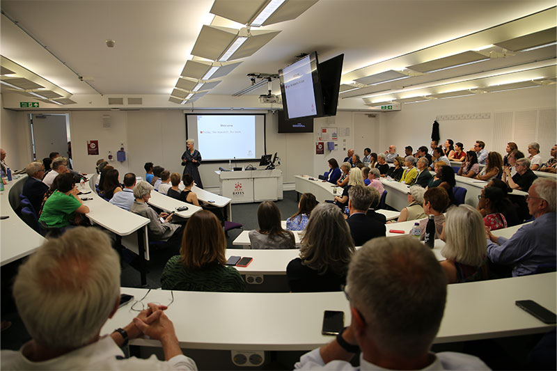 Professor Amanda Goodall delivers lecture to a full lecture theatre