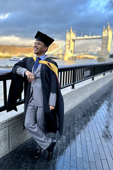 MICL alumni Daneil Liendo standing near Tower Bridge in London