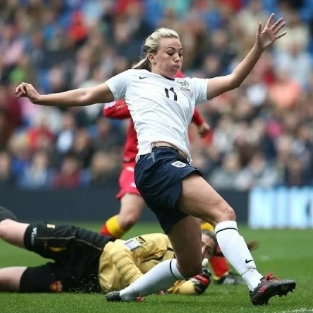 England women footballer playing against Montenegro