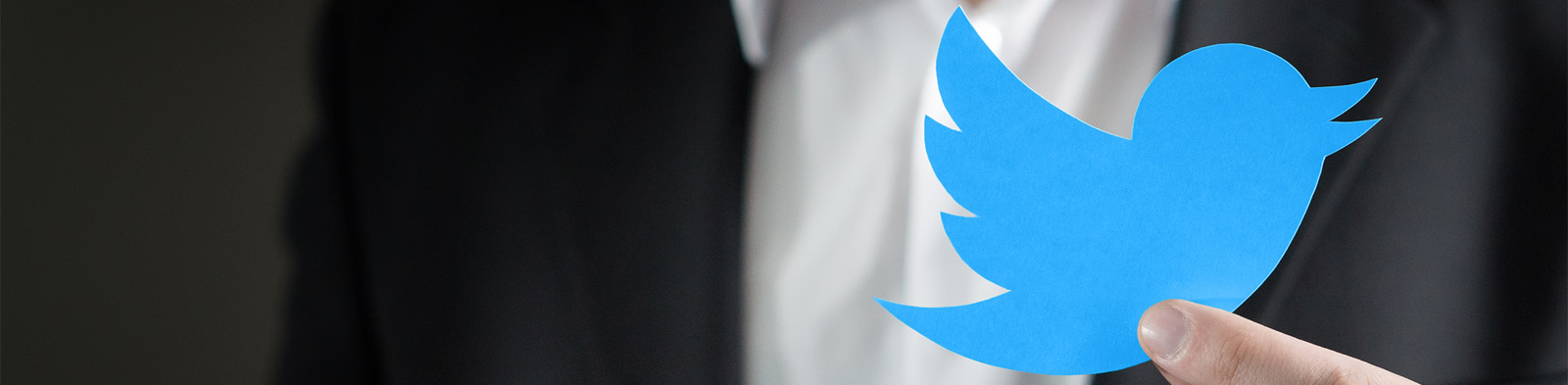 Corporate figure and Twitter logo
