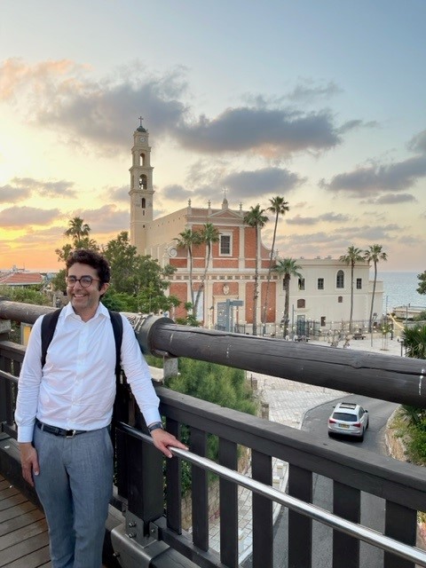 Pedro Franco on the Israel and Palestine Study Tour with the sunset behind him