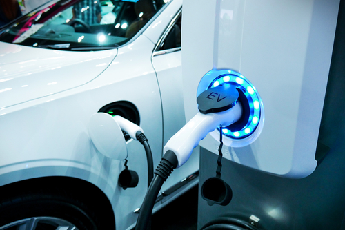 An electric car receives energy from powerpoint