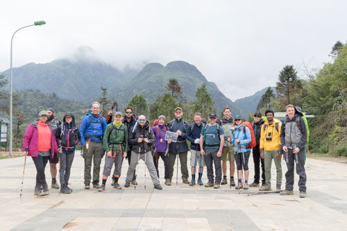 Group standing in front of Mount Fanispan in Vietnam