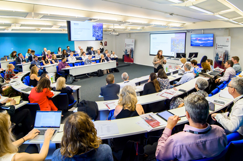 Lecture theatre room full with attends of the professions' summit