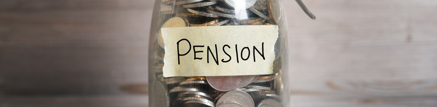 'Pension' taped on a glass jar of coins. 