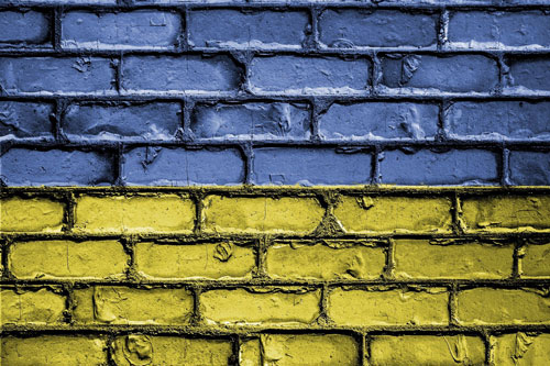 Ukrainian flag on rustic bricks
